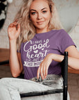 i-have-a-good-heart-but-this-mouth-team-purple-t-shirt-women-sarcastic-funny-mockup-of-a-woman-posing-on-a-chair