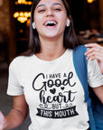 i-have-a-good-heart-but-this-mouth-white-t-shirt-women-sarcastic-funny-mockup-featuring-a-female-student-laughing
