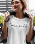 i-want-the-fairytale-black-t-shirt-mockup-of-a-joyful-woman-posing-by-a-city-street