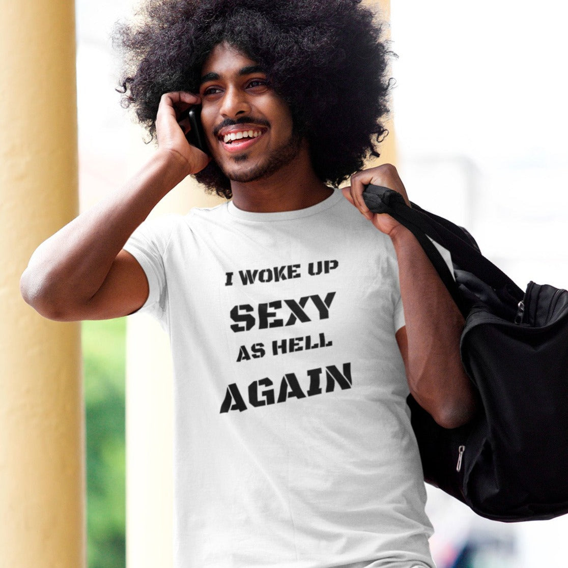 i-woke-up-sexy-as-hell-again-white-t-shirt-mockup-of-a-man-on-the-phone-walking-on-the-street