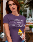 id-rather-be-home-with-my-dog-team-purple-t-shirt-animal-lover-mockup-featuring-a-woman-holding-an-ice-cream-cone