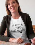 id-rather-be-home-with-my-dog-white-t-shirt-animal-loversmiling-woman-wearing-a-round-neck-t-shirt-mockup-while-eating-dessert-at-a-restaurant