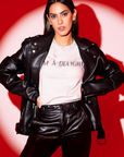 im-a-delight-white-t-shirt-womens-funny-sarcastic-bella-canvas-tee-mockup-featuring-a-serious-woman-posing-against-a-red-light-studio