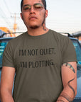im-not-quiet-im-plotting-army-green-t-shirt-funny-humor-mockup-of-a-tattooed-man-posing-on-the-street