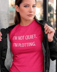 im-not-quiet-im-plotting-berry-t-shirt-funny-humor-mockup-of-a-woman-showing-off-the-t-shirt-under-her-bomber-jacket