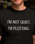 im-not-quiet-im-plotting-black-t-shirt-funny-humor-smiling-dude-wearing-a-tee-template-while-looking-to-the-camera
