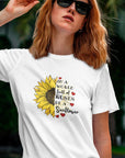 in-a-world-full-of-roses-be-a-sunflower-white-t-shirt-womens-mockup-featuring-a-cool-woman-with-sunglasses