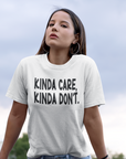 kinda-care-kinda-dont-white-t-shirtmockup-of-a-woman-on-a-shopping-cart-wearing-a-unisex-tee