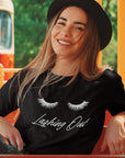 lashing-out-black-t-shirt-womens-mockup-of-a-happy-woman-on-a-tramway