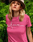 love-berry-t-shirt-womens-mockup-of-a-woman-with-a-basic-tee-posing-by-some-plants