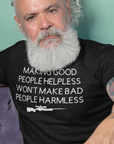 making-good-people-helpless-wont-make-bad-people-harmless-black-t-shirt-mockup-featuring-a-man-sitting-on-a-purple-sofa