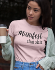manifest-that-shit-pink-short-sleeve-t-shirt-womens-mockup-of-an-asian-girl-having-a-coffee-outdoors