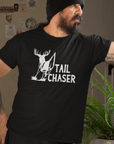 mockup-of-a-man-wearing-a-tail-chaser-black-t-shirt-and-looking-through-a-window