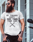 my-toolbox-cost-more-than-your-car-t-shirt-mockup-of-a-man-with-a-thick-beard-posing-next-to-a-motorbike
