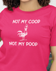 not-my-coop-not-my-poop-berry-t-shirt-chicken-funny-animal-bella-canvas-tee-mockup-featuring-a-smiling-woman-with-curly-hair