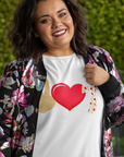 peace-love-jesus-white-t-shirt-religious-inspiring-plus-size-tee-mockup-featuring-a-joyful-woman-posing-in-front-of-a-leafy-background