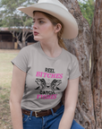 real-bitches-catch-fishes-athletic-heather-t-shirt-fishing-mockup-featuring-a-country-woman-wearing-a-crewneck-t-shirt-outdoors