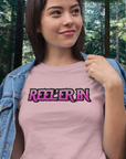 reeler-in-pink-t-shirt-mockup-of-a-happy-young-woman-wearing-denim-fishing