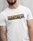reeler-in-white-t-shirt-mockup-of-a-man-leaning-against-a-concrete-wall-fishing
