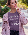 sarcasm-because-assault-charges-are-expensive-team-purple-t-shirt-women-funny-sarcastic-mockup-of-a-girl-with-an-urban-style-posing-at-downtown