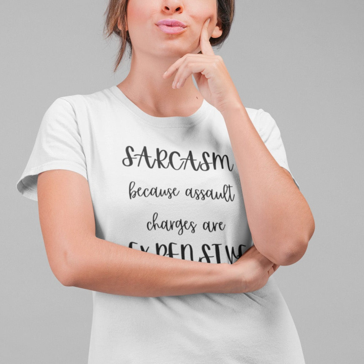 sarcasm-because-assault-charges-are-expensive-white-t-shirt-women-funny-sarcastic-round-neck-tee-mockup-of-a-pensive-woman-at-a-studio