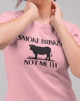 smoke-brisket-not-meth-pink-t-shirt-funny-cow-mockup-featuring-a-woman-wearing-a-round-neck-tshirt-while-at-a-studio