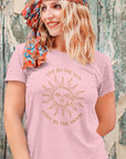 t-shirt-mockup-featuring-a-smiling-woman-posing-by-an-old-wooden-wall