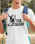 tail-chaser-t-shirt-mockup-featuring-a-smiling-man-hiking-at-the-woods