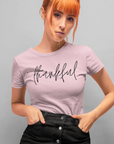thankful-pink-t-shirt-womens-inspiring-mockup-of-a-red-hair-girl-in-a-dark-skirt-posing-at-a-studio