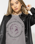 the-americantees-us-t-shirt-company-2023-athletic-heather-grey-tee-mockup-of-a-trendy-woman-posing-in-a-studio