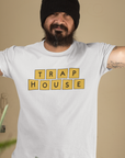 trap-house-mockup-of-a-tattooed-man-wearing-a-t-shirt-indoors