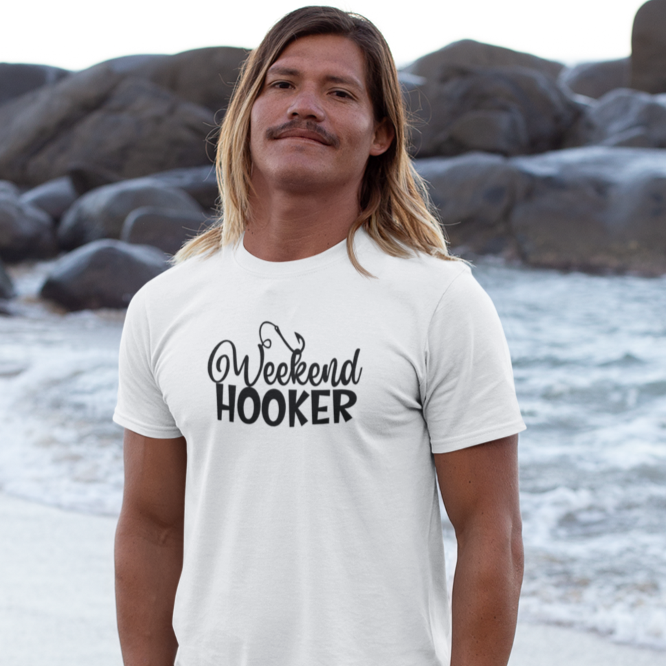 weekend-hooker-white-t-shirt-mockup-of-a-blonde-long-haired-man-barefoot-at-the-beach