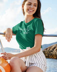 yeah-no-heathered-kelly-t-shirt-womens-mockup-of-a-happy-woman-sitting-on-a-yacht