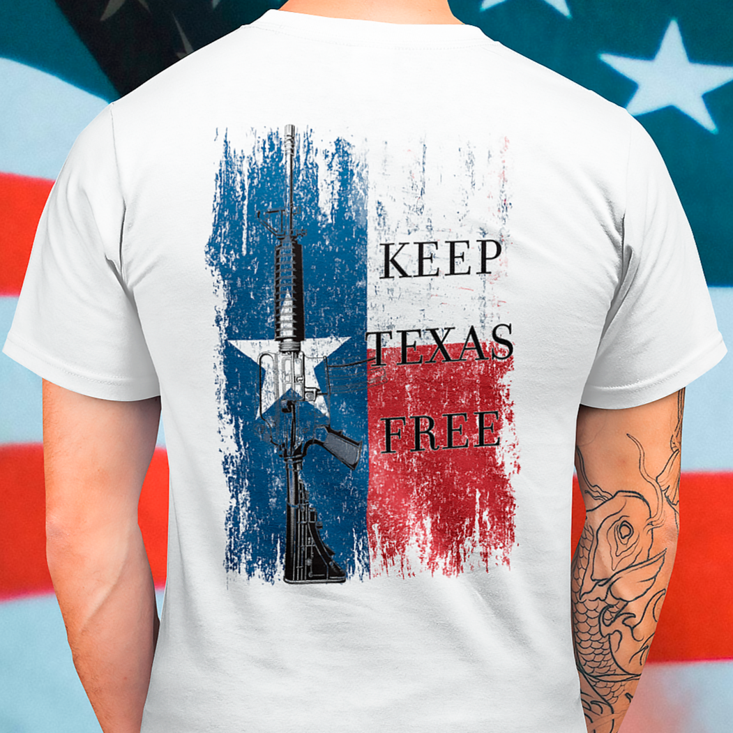 rear view of a man wearing a  white colored fabric shirt standing in front of an american flag with americantees.us logo on front and Texas flag with rifle and Keep Texas Free writing on back 