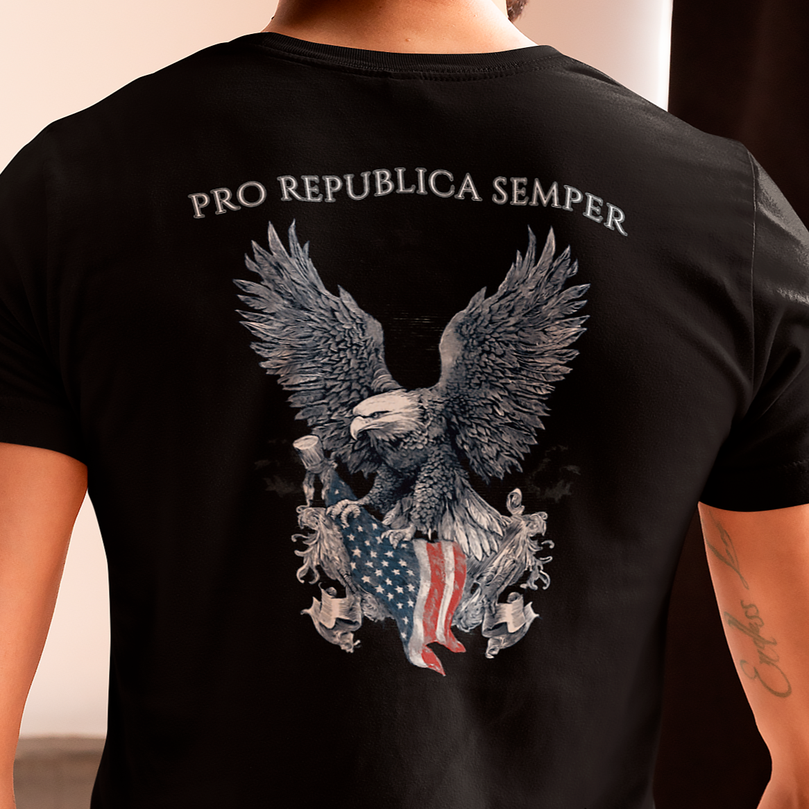 Patriotic Shirts man wearing a Pro Libertas Semper Flag Eagle Tee, black color, back side, featuring a bold eagle clutching an American flag with scrollwork on a unisex 100% cotton shirt, ideal for American pride
