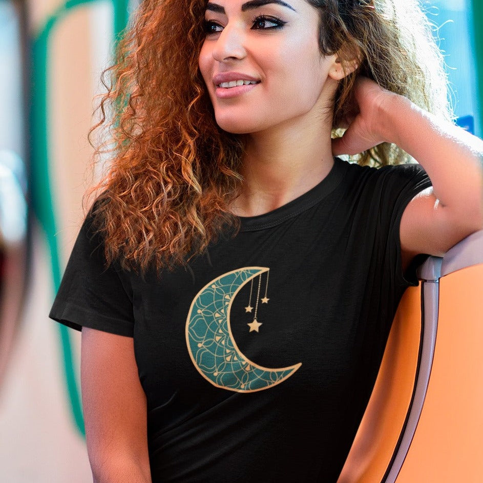 moonlit-charm-black-t-shirt-crescent-moon-with-hanging-stars-mockup-of-a-woman-taking-the-subway-to-go-home