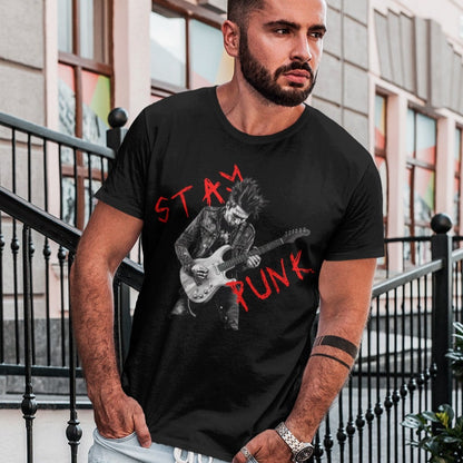 stay-punk-with-punk-rocker-guitarist-black-t-shirt-mockup-of-a-serious-looking-man-standing-on-concrete-steps