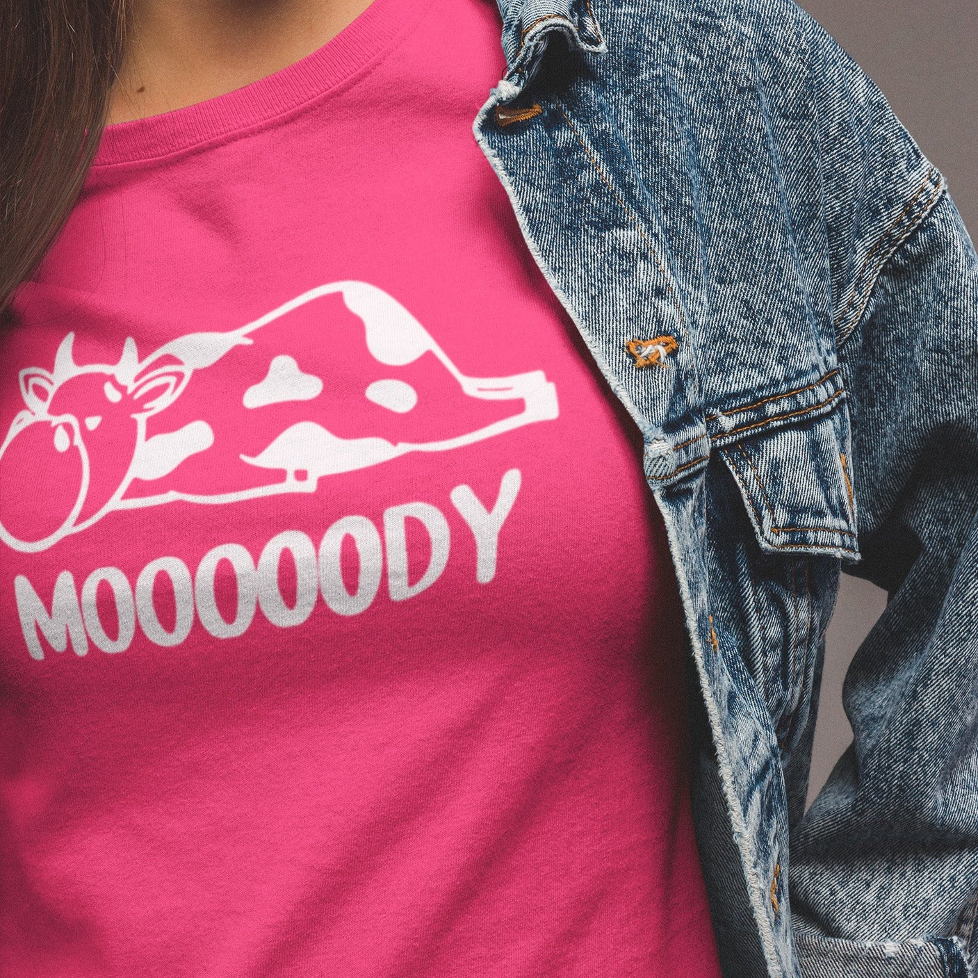Mooooody-cow-farm-berry-t-shirt-funny-mockup-of-a-woman-wearing-a-denim-jacket