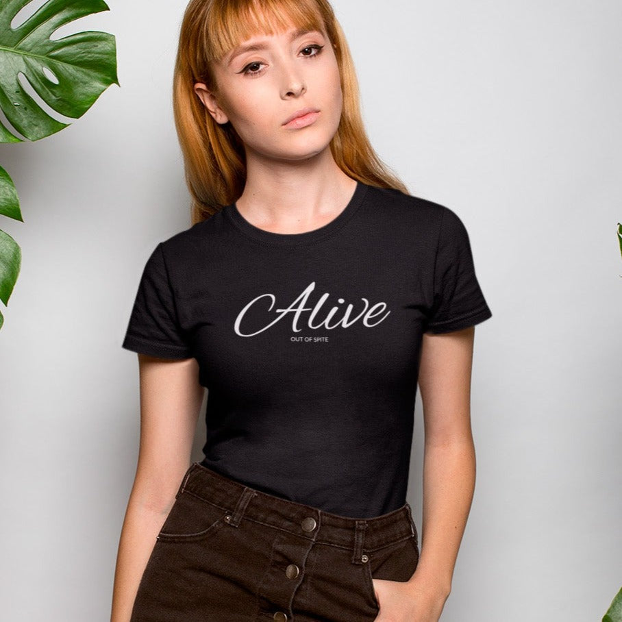 alive-out-of-spite-black-t-shirt-funny-beautiful-woman-wearing-a-round-neck-tshirt-mockup-near-plants