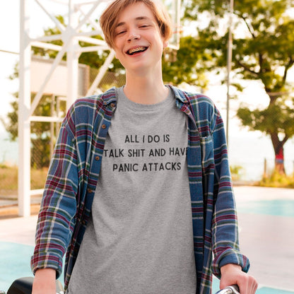 all-i-do-is-talk-shit-and-have-panic-attacks-athletic-heather-t-shirt-funny-unisex-mockup-featuring-a-happy-young-man-with-a-bicycle