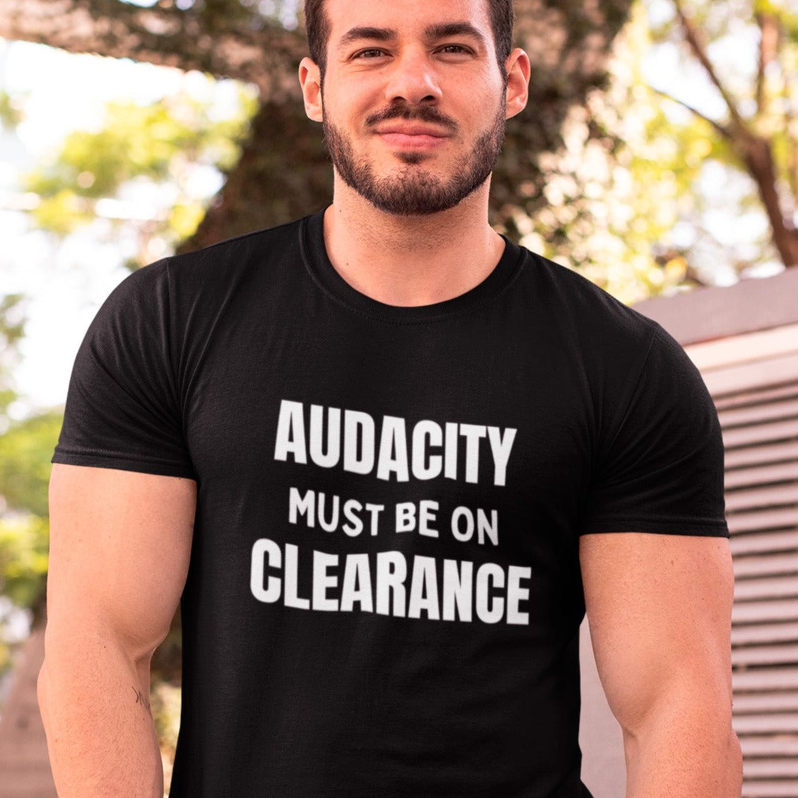 audacity-must-be-on-clearance-black-t-shirt-unisex-funny-mockup-of-a-muscled-man-smirking-at-the-camera