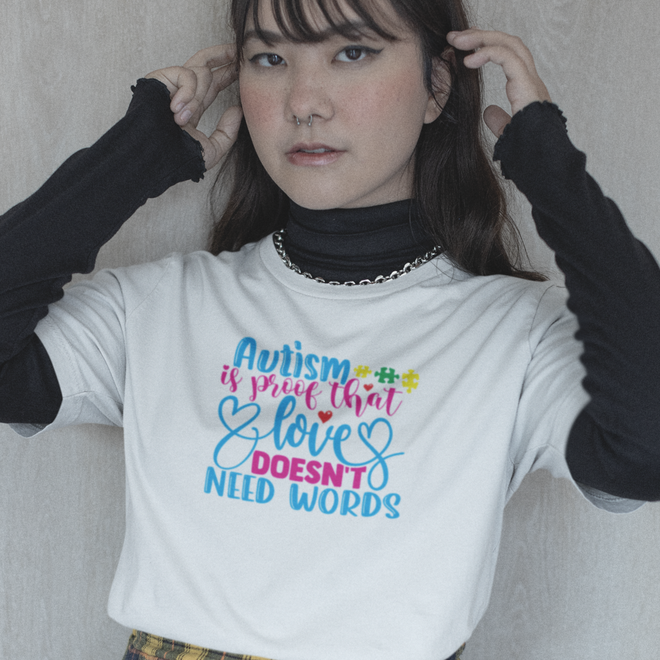 autism-is-proof-that-love-doesnt-need-words-white-t-shirt-awareness-mockup-of-a-serious-e-girl-wearing-a-bella-canvas-tee