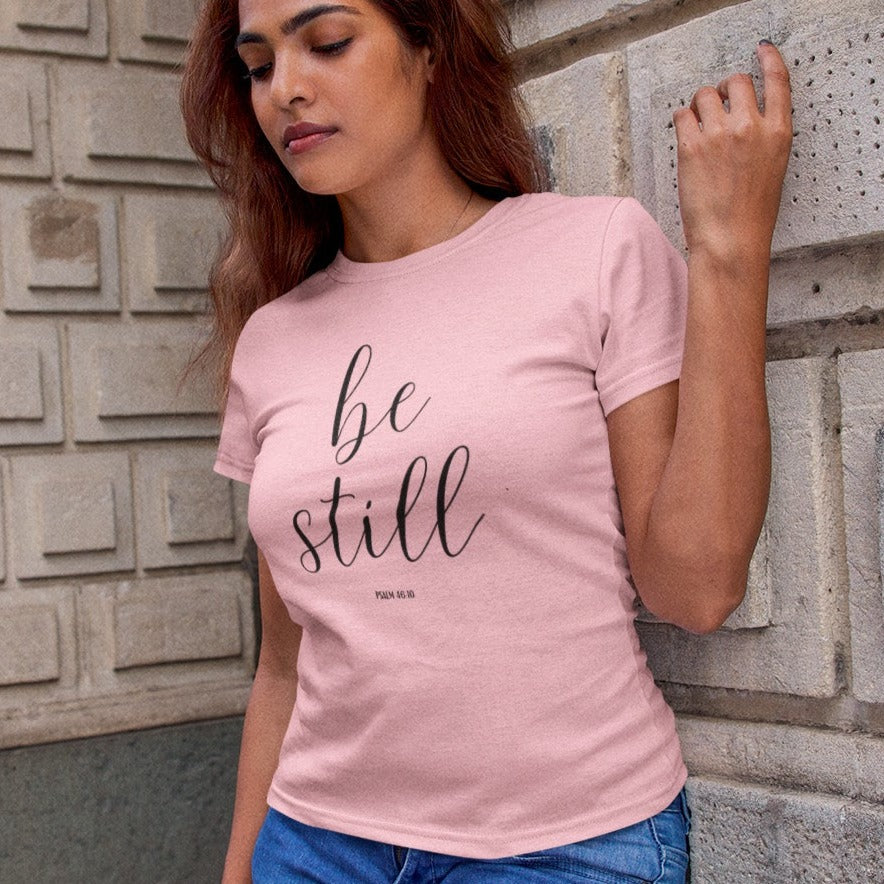 be-still-psalm-46-10-pink-t-shirt-womens-christian-inspiring-mockup-of-a-woman-with-long-hair-leaning-on-a-brick-wall