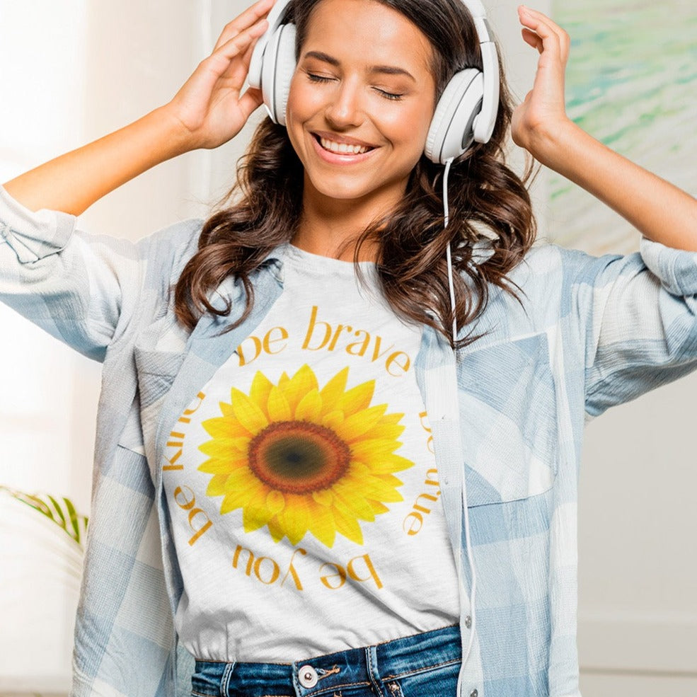 be-true-be-you-be-kind-be-brave-white-t-shirt-sunflower-womens-mockup-of-a-woman-happily-listening-to-music-at-home