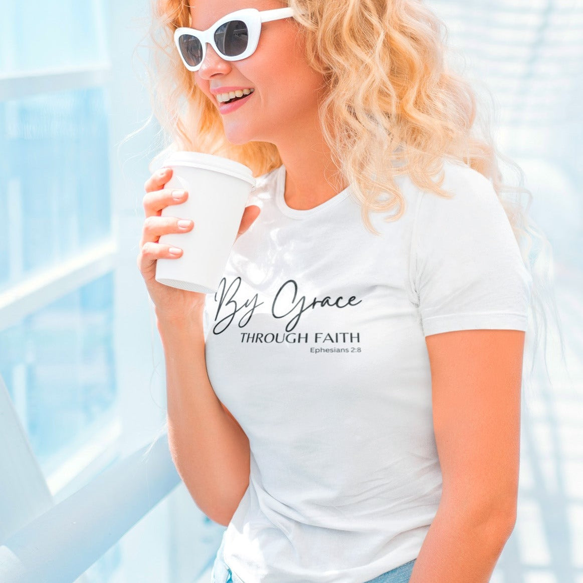by-grace-through-faith-ephesians-2-8-white-t-shirt-womens-faith-inspiring-mockup-featuring-a-blonde-woman-with-sunglasses