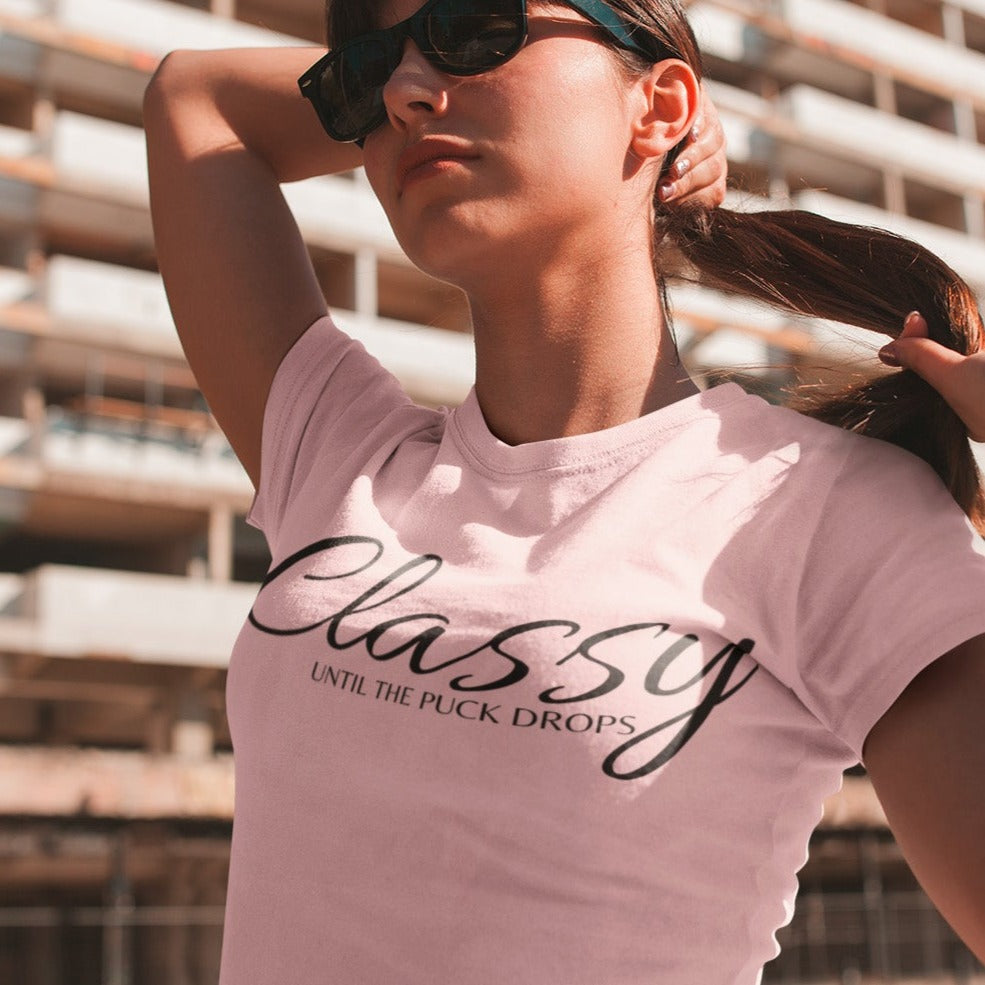classy-until-the-puck-drops-pink-t-shirt-hockey-womens-mockup-of-a-girl-with-a-ponytail-and-sunglasses-on-the-street