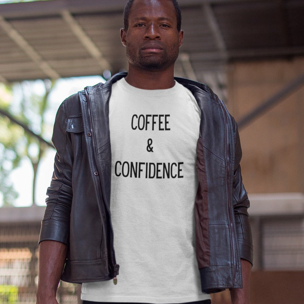 coffee-and-confidence-white-t-shirt-unisex-guy-wearing-a-tee-mockup-and-a-gray-jacket-while-on-top-of-a-building