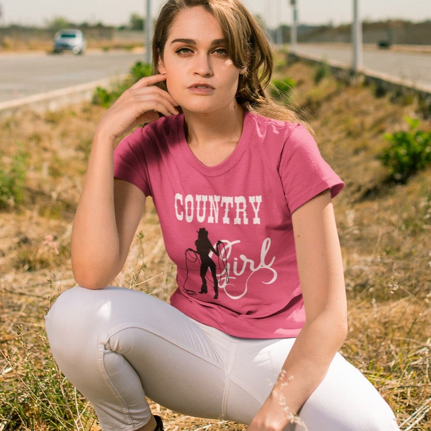 country-girl-with-lasso-berry-t-shirt-cowgirl-mockup-of-a-woman-in-a-crouching-pose-outdoors