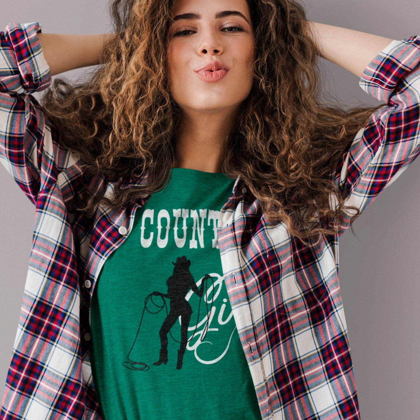 country-girl-with-lasso-heather-kelly-green-t-shirt-cowgirl-mockup-of-a-woman-grabbing-her-hair-in-a-studio