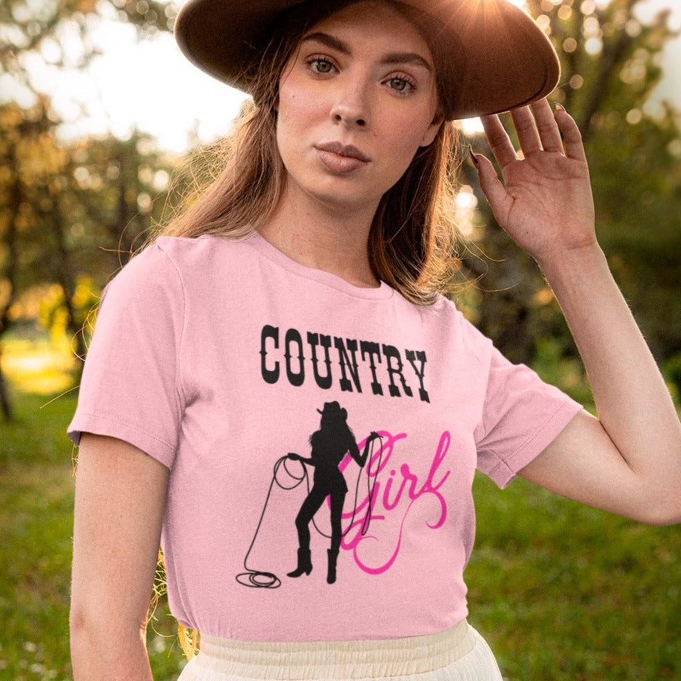 country-girl-with-lasso-pink-t-shirt-cowgirl-bella-canvas-t-shirt-mockup-of-a-woman-posing-in-nature